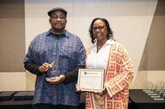 Charles Davis and Roberta Davis accept the 2025 Sarah Bennett Holmes team award for “Operation Be You.” 