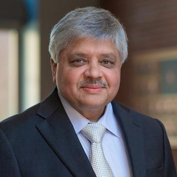 Professional headshot of Abhijit Patwardhan.